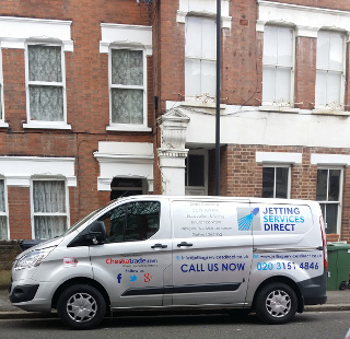 Investigating blocked drains at a flat in Northlands Street, Camberwell, South London SE5