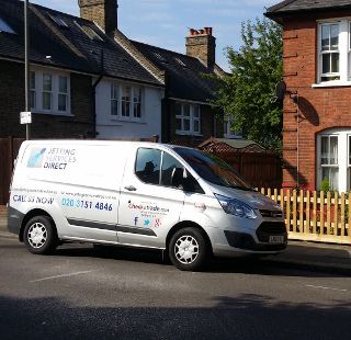 High pressure jetting a blocked drain in Derinton Road, Tooting, South London SW17